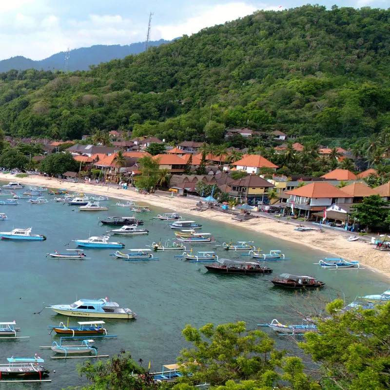 Padang-Bai-Habour-With-Boats-on-the-Sea-and-Traditional-Houses