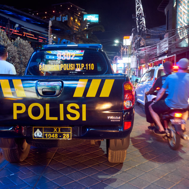 Police-Truck-Stops-On-Street-In-Kuta-At-Nighttime