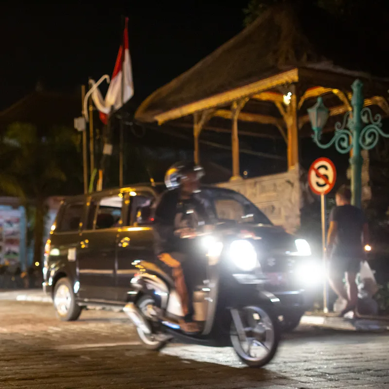 Bali-Traffic-At-Night-Scooter-And-Van