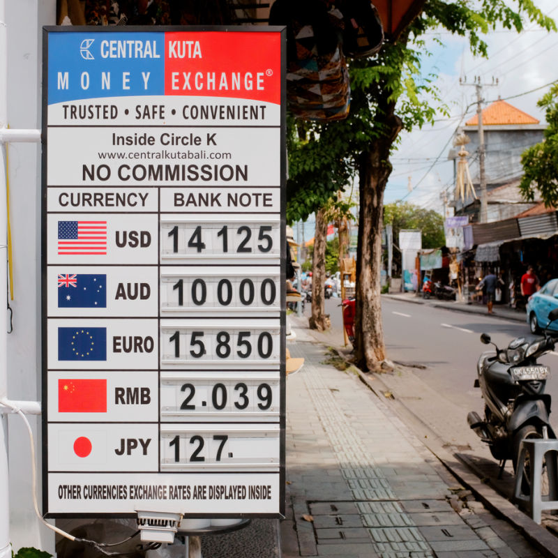 Currency-Money-Exchange-Signboard-On-Kuta-Street-Bali