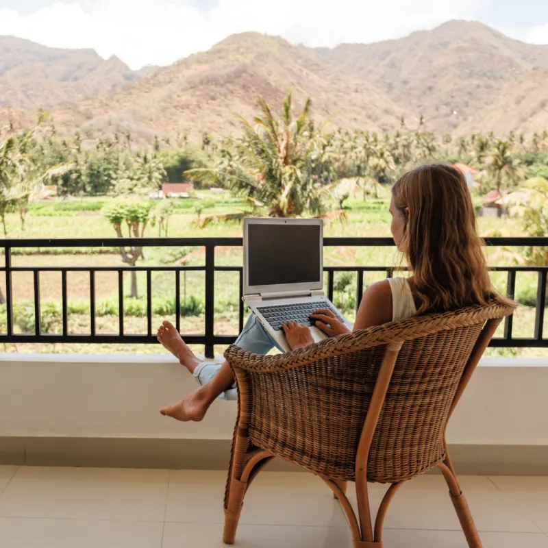 Digital-Nomad-Works-On-Her-Laptop-Overlooking-Bali-Countryside