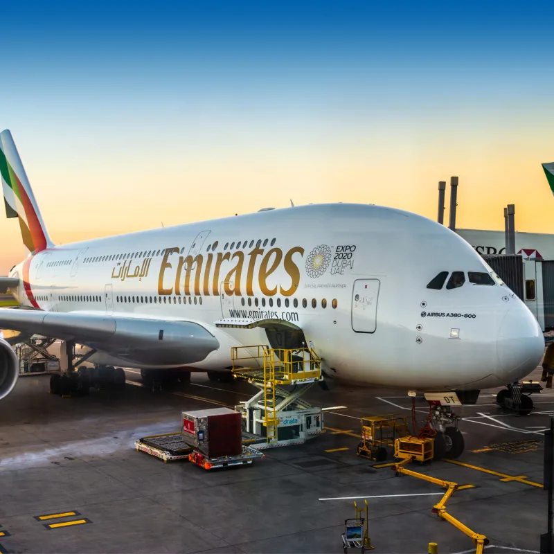 Emirates-Airline-Plane-At-Terminal-Building-At-Sunset