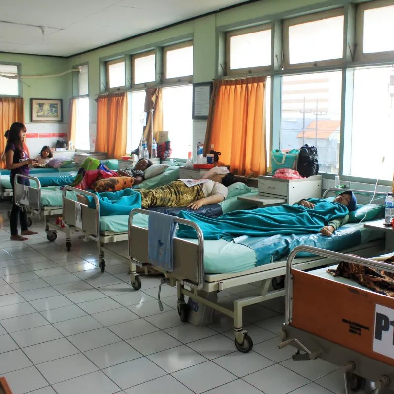 Local-Hospital-Ward-With-Patients-In-Bed-On-IV-Drips