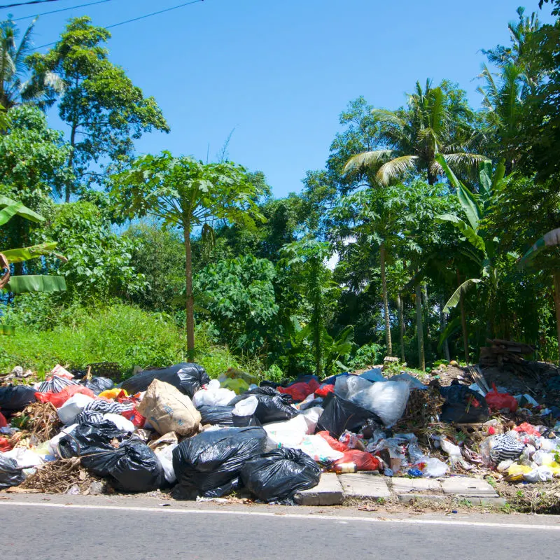Trash-And-Plastice-Waste-Piles-Up-At-The-Side-Of-A-Road-In-Rural-Bali