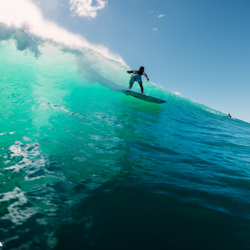 Surfer-In-Uluwatu-Bali-On-Ocean-Wave