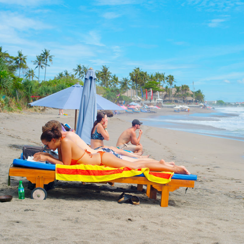 Tourists-Sunbathe-On-Berawa-Beach-In-Canggu-Bali