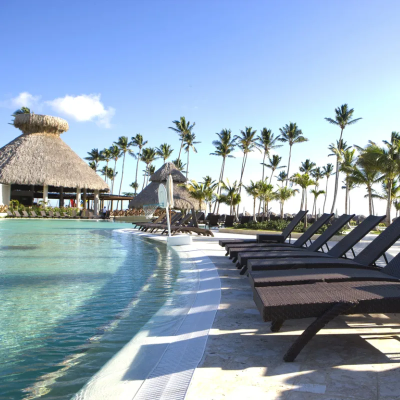 Tropical-Beachside-Resort-With-Palm-Trees-And-Swimming-Pool