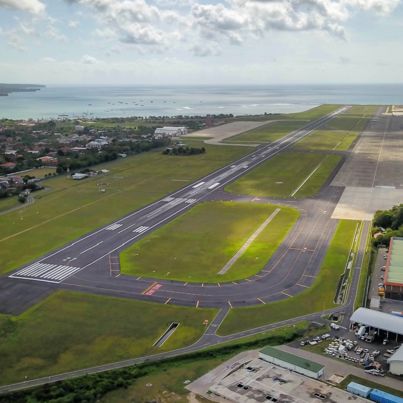 Ariel-Shot-Of-Runway-At-Bali-Airport-Close-To-Ocean