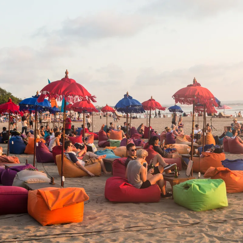 Bali-Tourists-Realx-On-Kuta-beach-At-Sunset