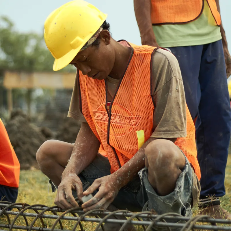 Construction-Worker-In-Bali-Works-On-Metal-Frame