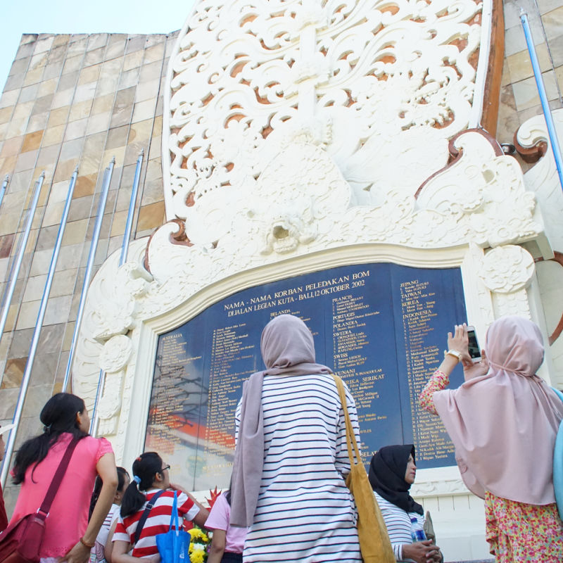 People-Stand-Beneath-The-Bali-Bombing-Memorial-In-Kuta-1