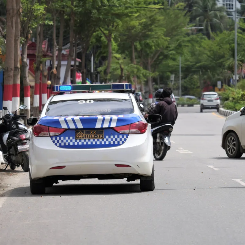 Police-Car-Drives-Down-Bali-Street
