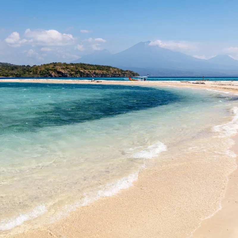 West-Bali-National-Park-Blue-Ocean-Looking-At-Bali-Volancos-And-Mountains