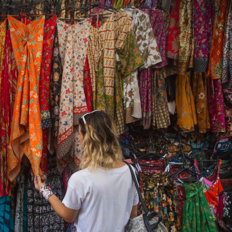 Woman-Is-Shopping-For-Textiles-at-Market-Stall-In-Bali