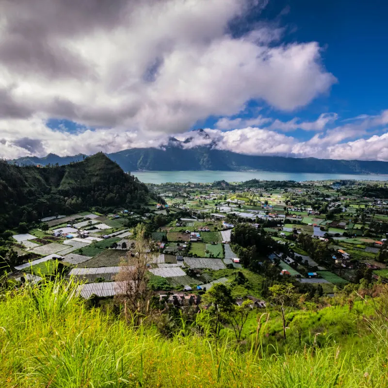 Ariel-View-Of-Kintamani-Songan-Village-In-Bali-And-Lake-Batur-In-The-Distance