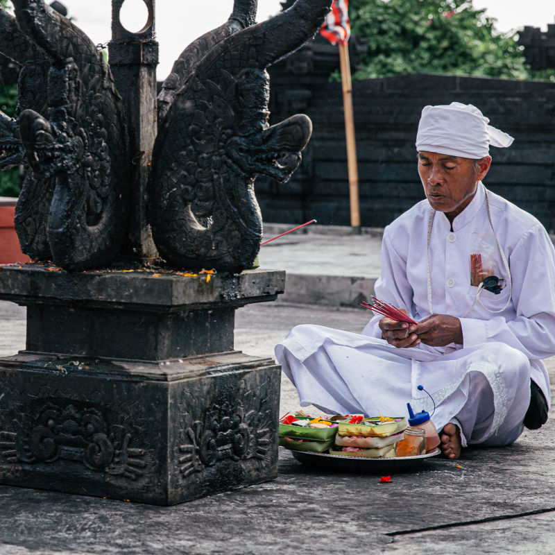 Bali Priest Makes Offerings At Temple In Bali.