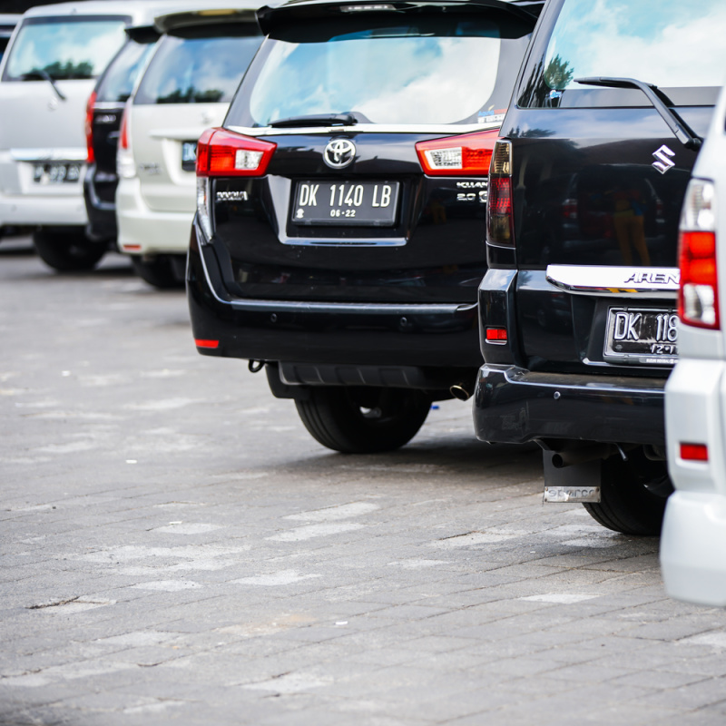 Black And Silver People Carrier SUV Cars Taxi Lined Up In Bali.jpg