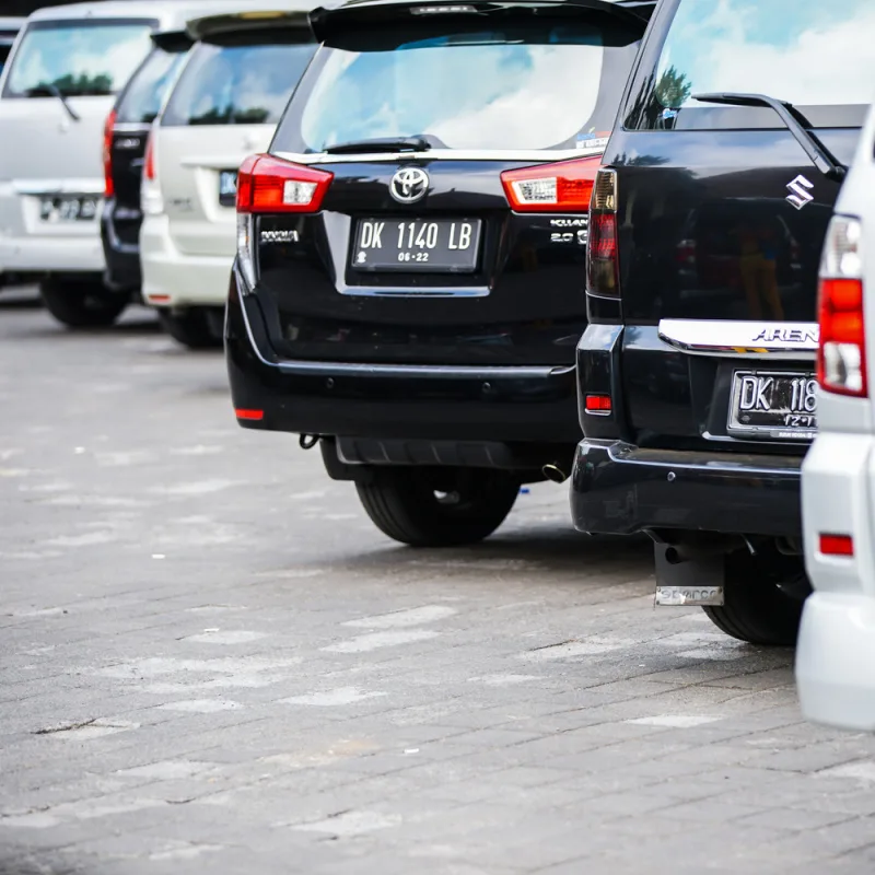 Black and silver people carrier SUV car taxis lined up in Bali.jpg