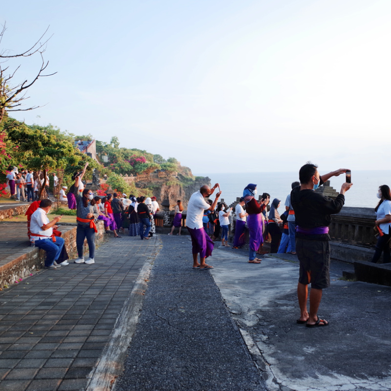 Domestic Tourists In Bali Uluwatu Take Photos At Temple