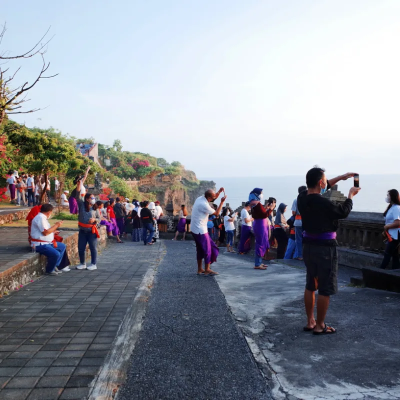 Domestic Tourists In Bali Uluwatu Take Photos At Temple