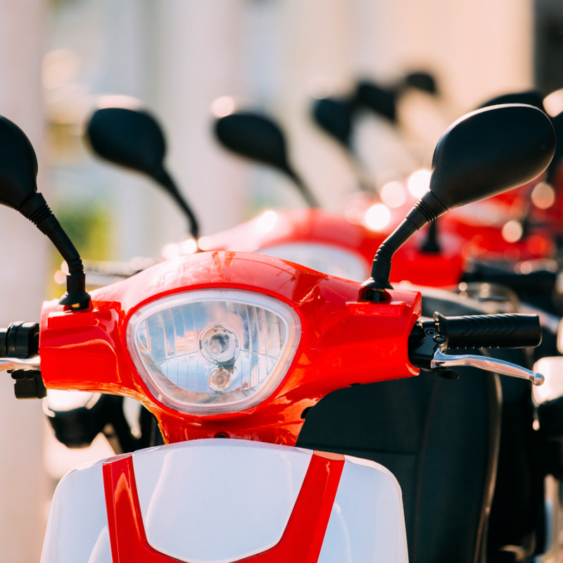 Electric-Moped-In-White-And-Red-Lined-Up