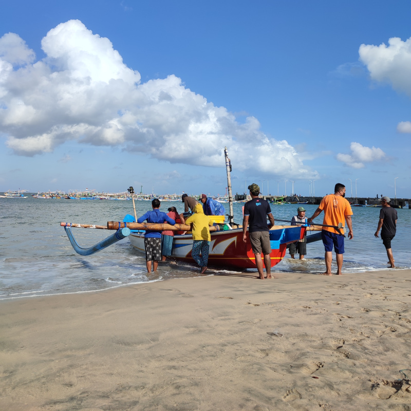 Fishermen-In-Bali-Launch-Boat-Into-The-Ocean