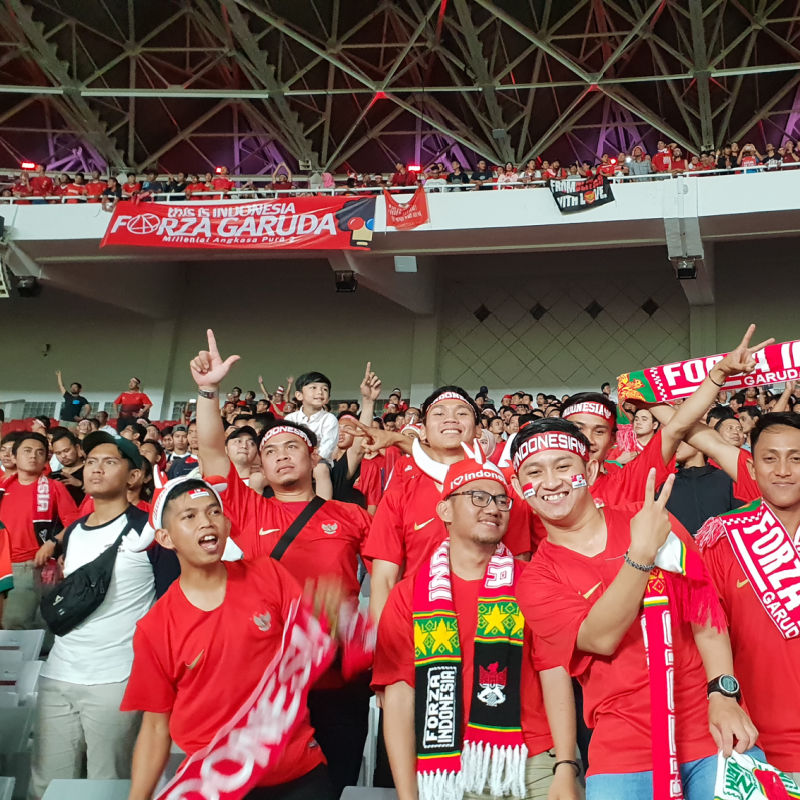Indonesian Football Fans Support The National Soccer Team In A Stadium