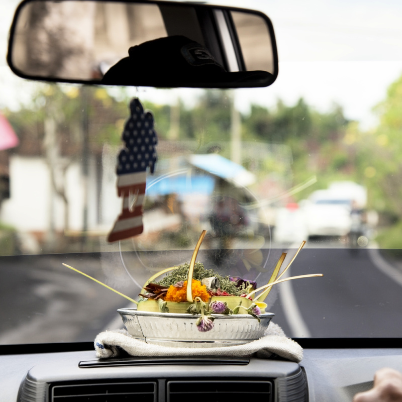 Inside-Of-A-Bali-Taxi-With-Hindu-Offering-On-The-Dashboard