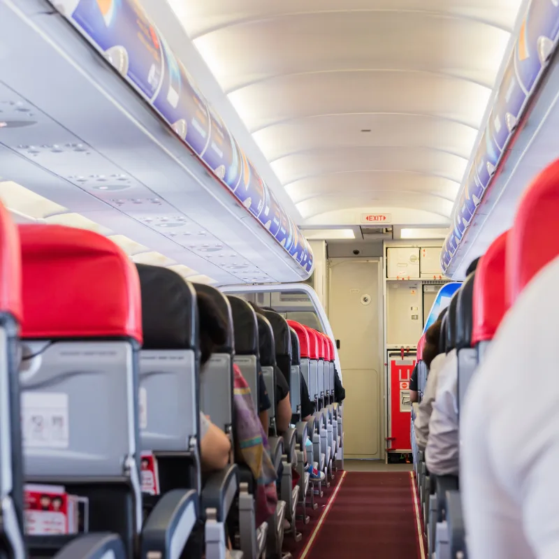 Inside Of An Airplane Seats Looking Forward.