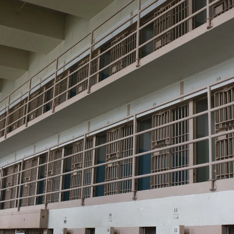 Line Of Prison Cells Across Two Floors