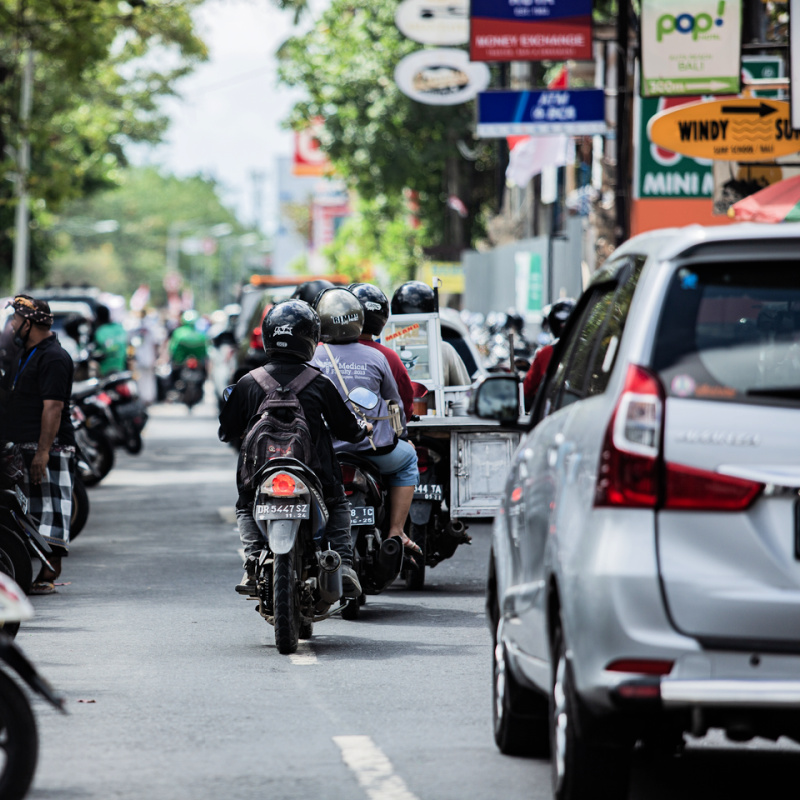 Moped-And-Cars-Drive-Down-Busy-Bali-Street