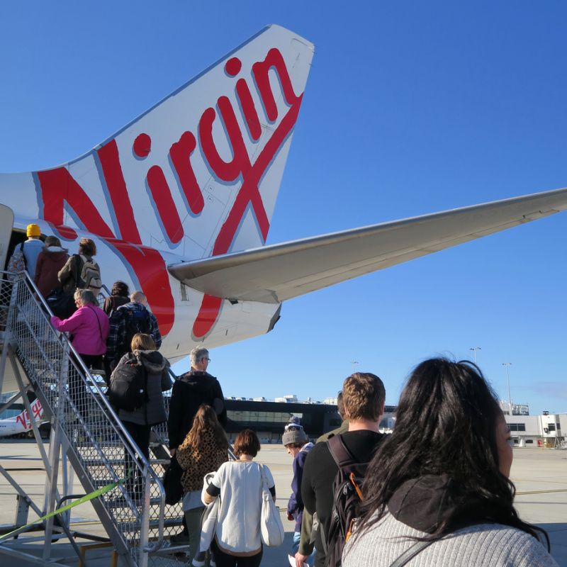 Passengers Queue To Board Virgin Australia Plane