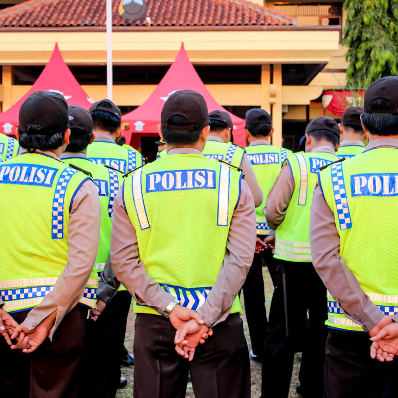Police Officers In Bali Indonesia Stand To Attention Wearing High Vis Jackets