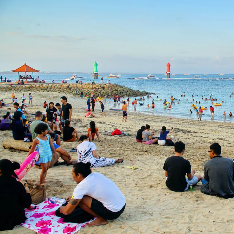 Tourists-Relax-On-Sanur-Beach-On-A-Sunny-Day