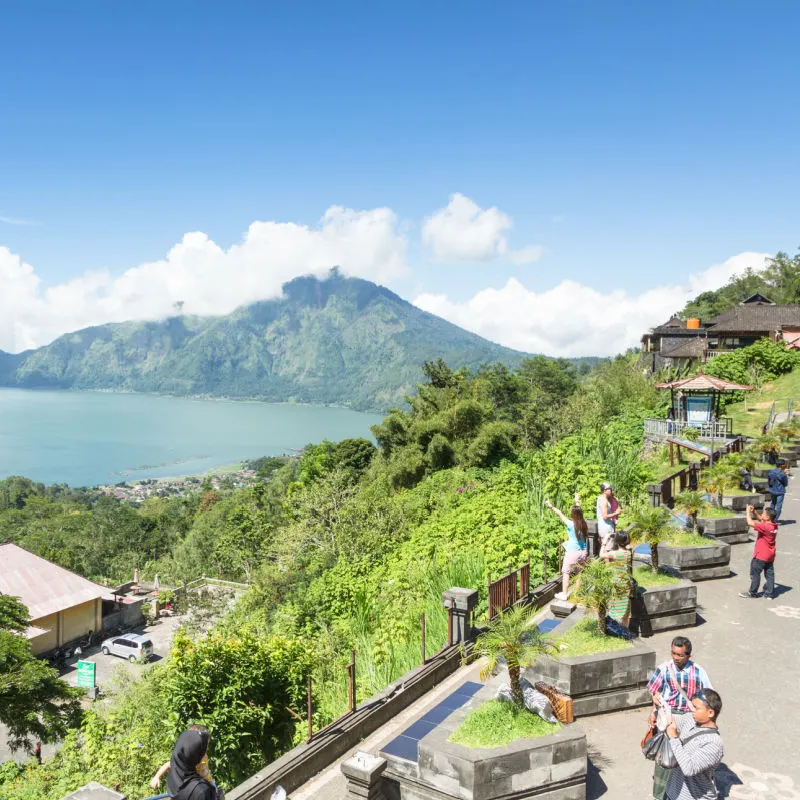 Tourists Visit Lake Batur In Bali On A Sunny Day