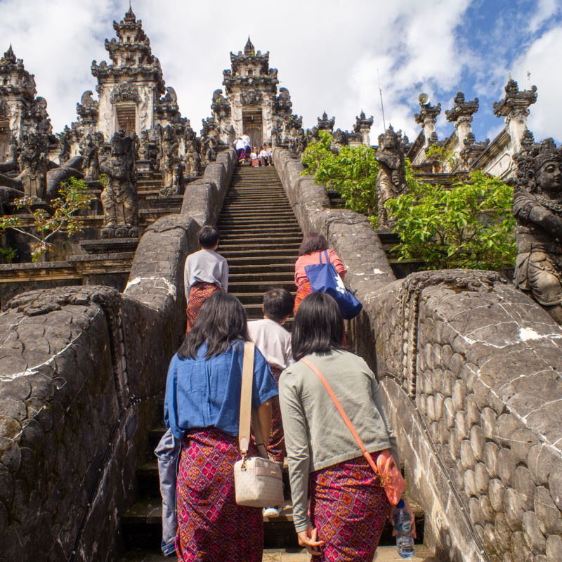 Chinese Tourists Climb Up Stairs Towards Bali Temple