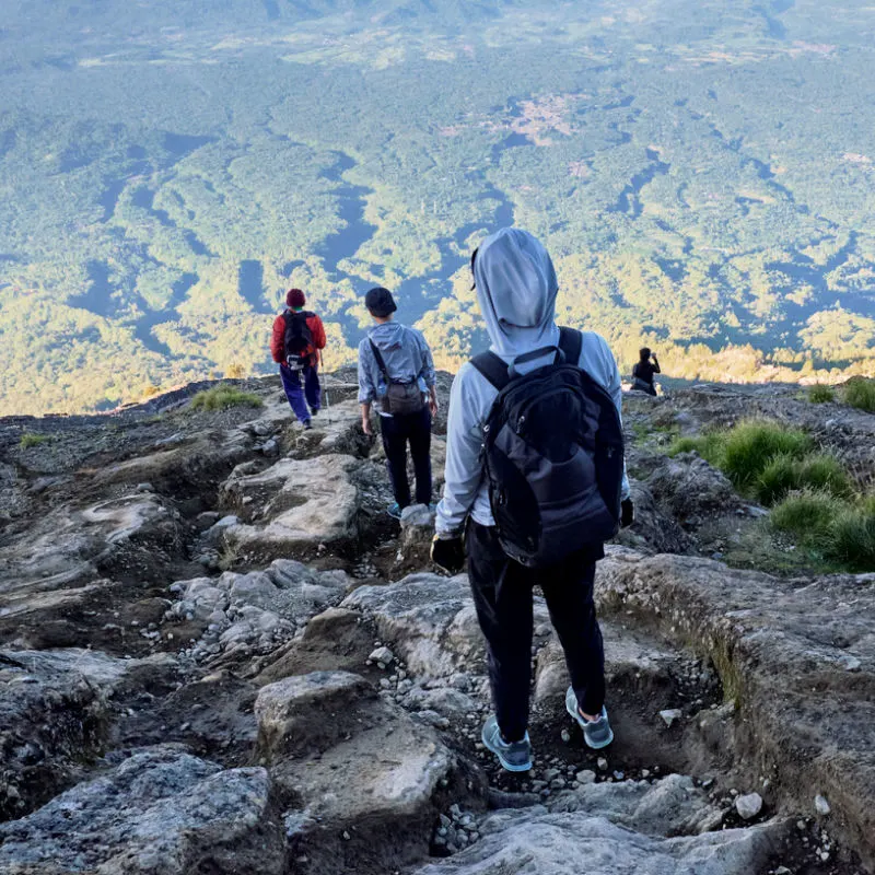 Climbers-and-Hikers-Walk-Down-Rocky-Trail-of-Mount-Agung-in-Bali