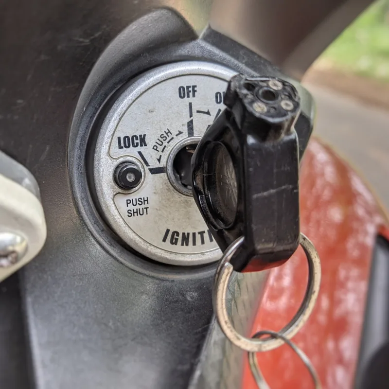 Close Up Of Moped Keys In The Ignition