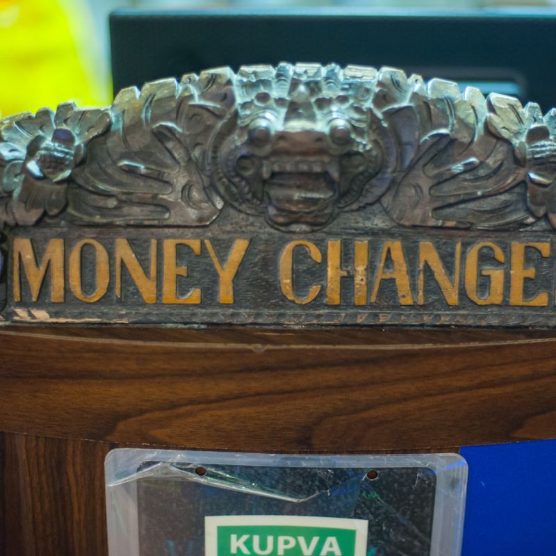 Close Up Of Wooden Money Change Sign