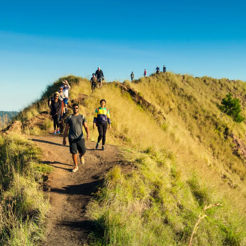 Hikers and Climbers Walk Down From Mount Agung On A Sunny Day In Bali.jpg