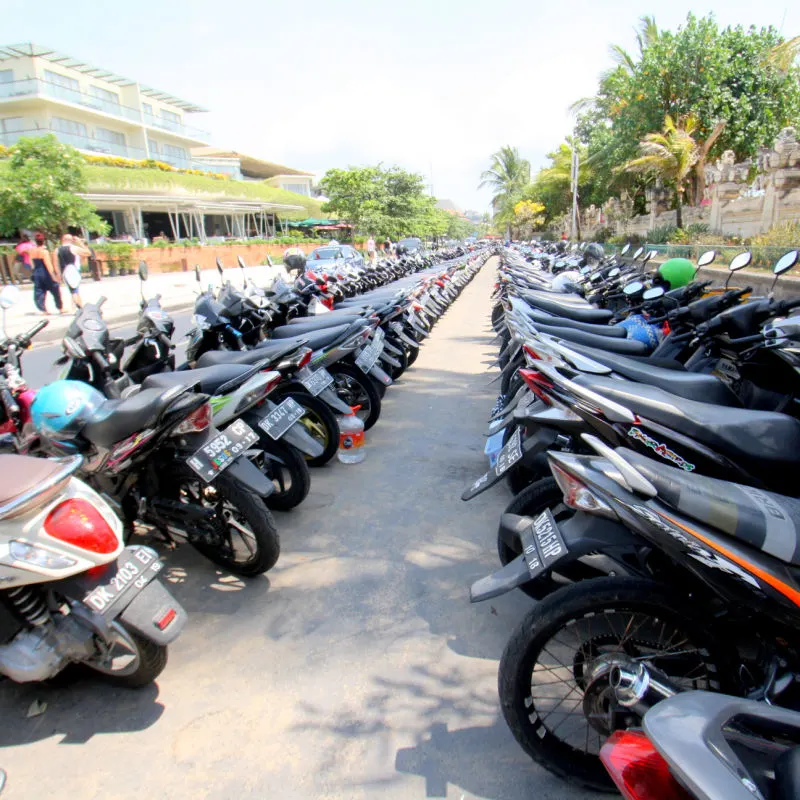Mopeds-Parked-In-A-Line-Outside-Bali-Shopping-Mall-Next-To-Kuta-Beach