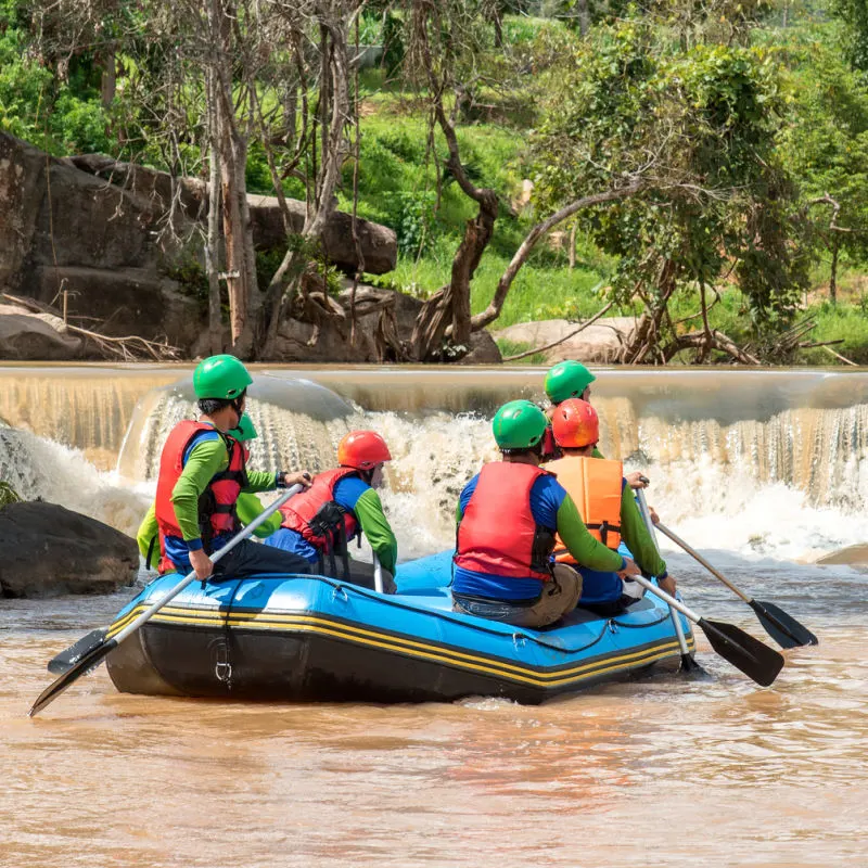 Raft-Carrying-Tourists-On-Ayung-River-In-Ubud-Heads-Towards-Rapids