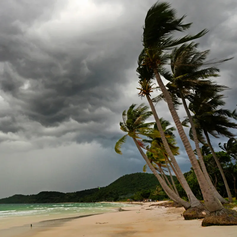 Rain clouds and storm pass over Bali beach