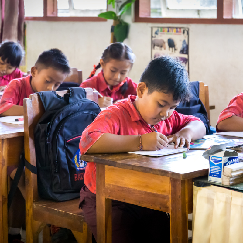 School Children In Bali Work At Their Desks