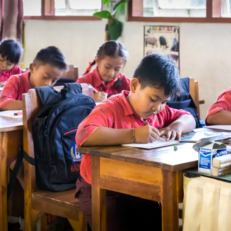 School Children In Bali Work At Their Desks