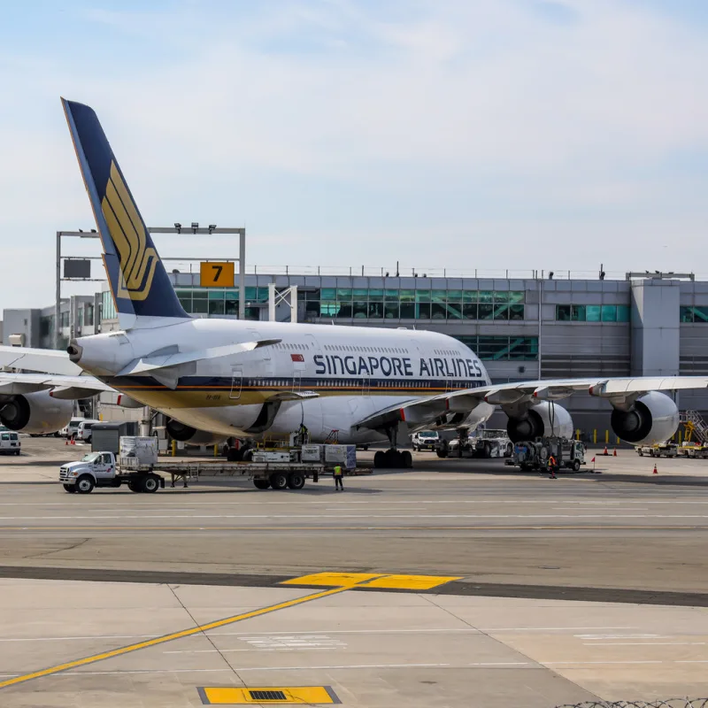 Singapore Airlines Airplane At Airport Terminal Building