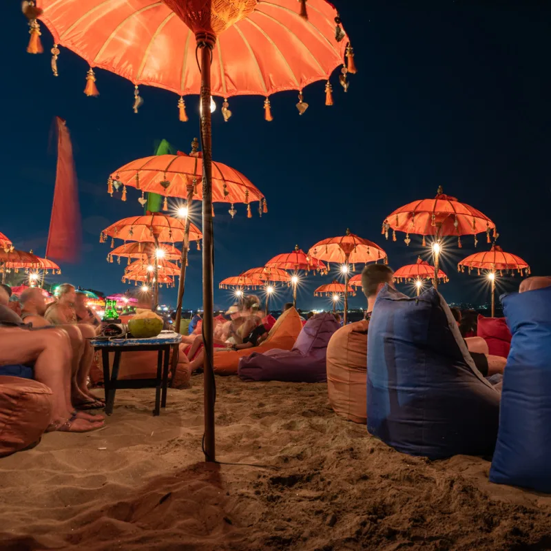 Umbrellas On The Beach At Night Close To Canggu In Bali
