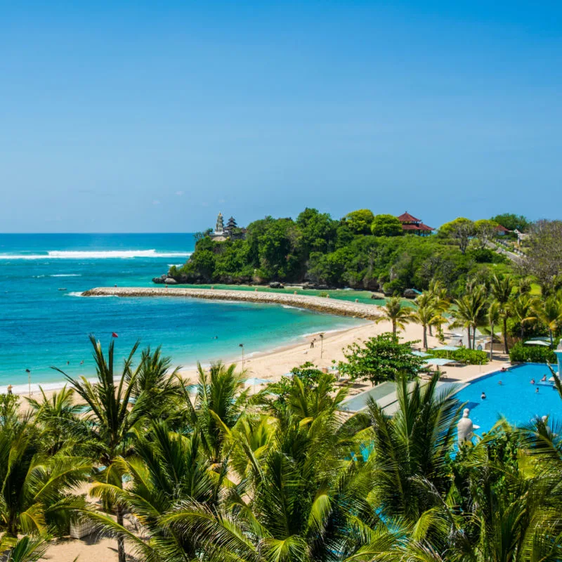 View-of-Quiet-Bali-Beach-Hotel-Resort-Overlooking-Palm-Trees-And-Ocean