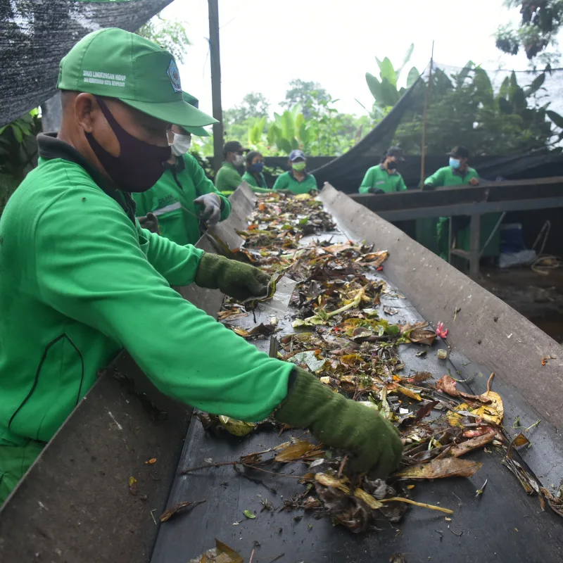 Waste Management Workers On Garbage Organic Waste Conveyer Belt.