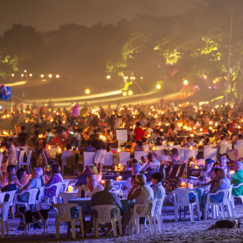 Bali-Beach-At-Nightime-With-Hundredds-Of-Tourists-At-A-Dining-Party